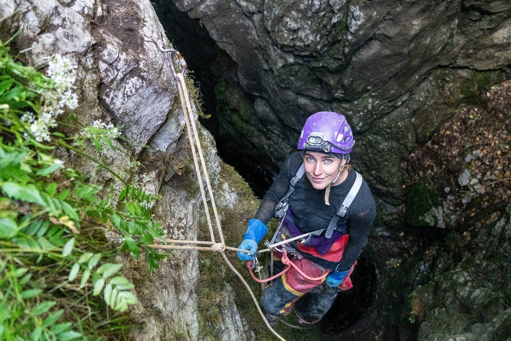 Penelope Vorster at the top of Još trideset metara entrance shaft. Montenegro, 2022 Photo: Sara Fleetwood