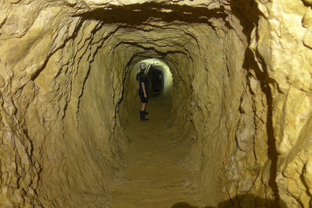 A man carved tunnel leading to a cave. Photo: Mike Ficco
