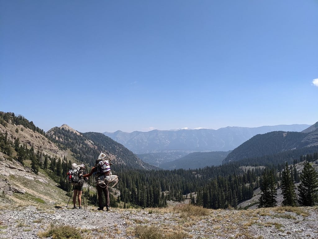 Two cavers carrying gear from the mountain after a cavign expedition. Photo: Katarina Kosič Ficco