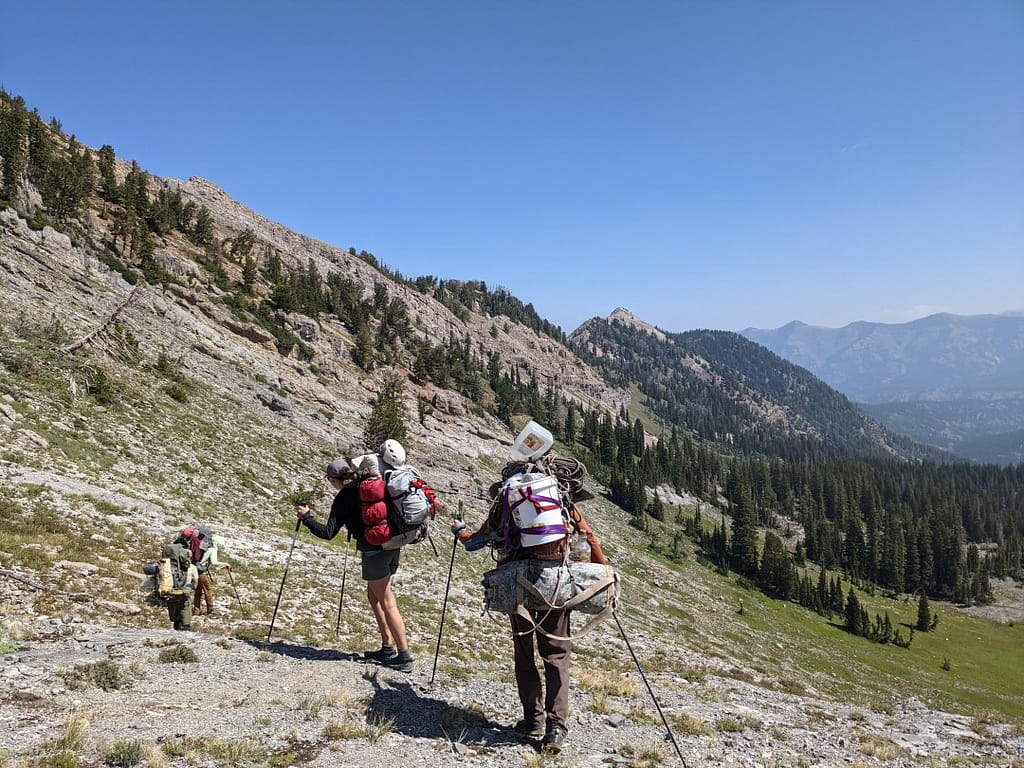 Cavers are descending a mountain after a week long expedition with 40 kg (80 pounds) backpacks. Photo: Mike Ficco
