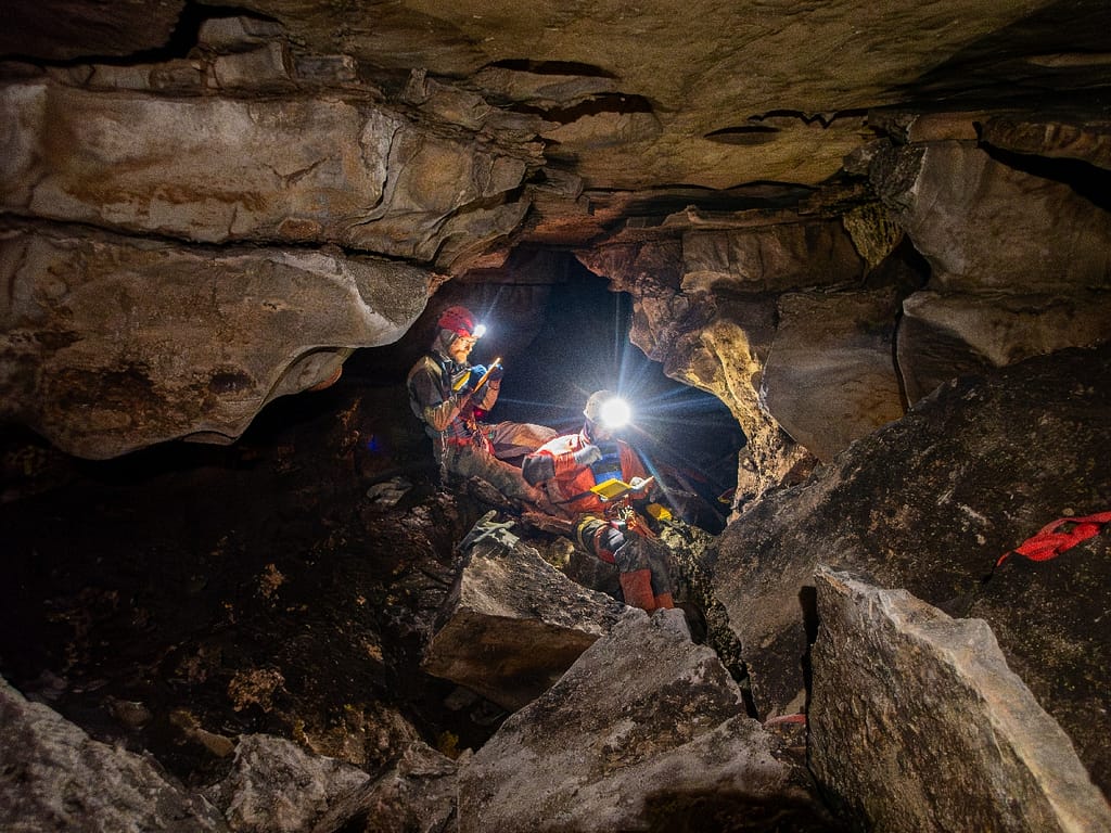 Surveying and mapping a cave passage. Mike Ficco and Philip Schuchradt in Crna Tuba (black tube), as we named the passage, because of the dark rock. Phot: Katarina Kosič Ficco
