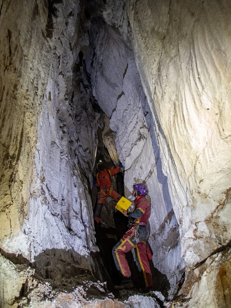 Katarina and Penelope in Moon passage in Vručični Snovi Cave. Montenegro, 2022.. Montenegro. Photo: Katarina Kosič Ficco